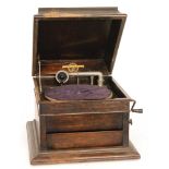 A Columbia No 119 oak cased table top wind up gramophone with adjustable speaker doors,