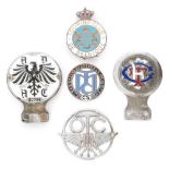 A 1930s Prussian enamelled car badge No 37796, an enamelled TCM badge, an OTC chrome badge,