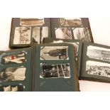 An Edwardian album containing real photographic cards, greetings, street scenes, seaside,