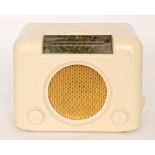 A 1950s Bush DAC 90A valve radio in ivory Bakelite, length 30.