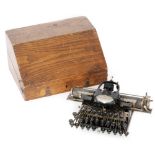 A No 5 Blickensderfer typewriter in fitted oak case, width 31cm.