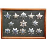 A collection of late 20th Century American sheriff and deputy sheriff stars,