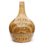 An early 20th Century stoneware Mackie & Co Whiskey bottle transfer decorated with 'The Greybeard