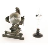 A mid 20th Century sunshine recorder by Negretti and Zambra London with revolving glass sphere on