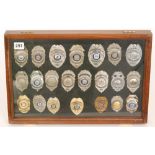 A collection of late 20th Century American enamelled and plain police badges,