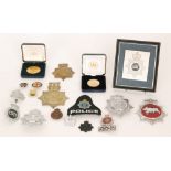 A collection of police helmet badges from various divisions to include South Yorkshire, Manchester,