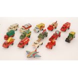 A collection of British made clockwork tinplate commercial lorries including an aeroplane.