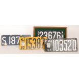 American licence plates Penna 1914 103520 another NJ 15387 each mounted with a numbered badge,