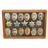 A collection of late 20th Century American enamelled police officer's badges and stars,