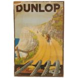 A 1930s pictorial cardboard advertising shop display sign for Dunlop,