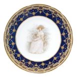 A Copelands China cabinet plate decorated with a hand painted Edwardian lady sat in a garden,