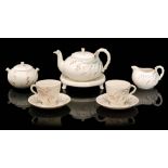 A 19th Century Belleek Grass pattern tete-a-tete set comprising a teapot (S/D),