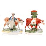 Two 19th Century Staffordshire figures of cows,