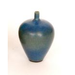 A Ruskin Pottery tradesman's miniature vase of swollen tapering form with small pronounced neck,