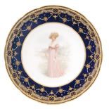 A Copelands China cabinet plate decorated with a hand painted Edwardian lady standing in a