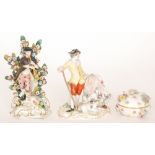 An early 20th Century Meissen figurine of a lady and gentleman with a lamb at their feet,