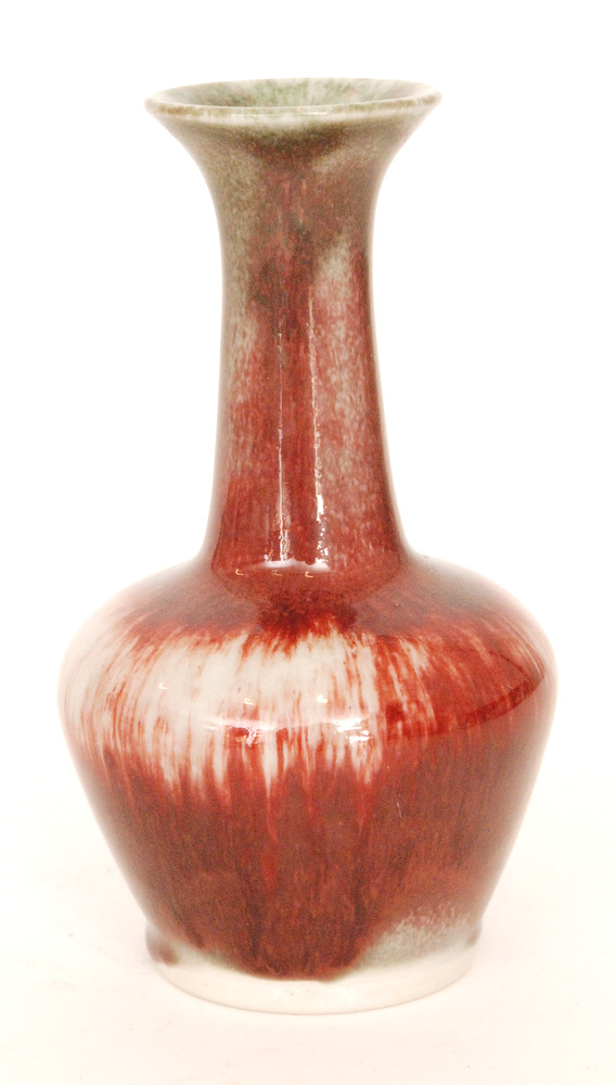 A Cobridge Pottery Stoneware high fired vase of globe and shaft form with a red sang de beouf type