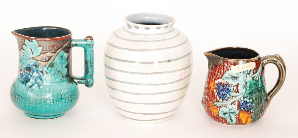 Three pieces of assorted Anita Harris pottery comprising two jugs and a vase, all with printed