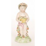 An early 20th Century figure of a cherub holding a basket of flowers with matching flowers in his