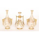 Three late 19th Century Royal Worcester blush ivory vases comprising a pair of vases with pierced