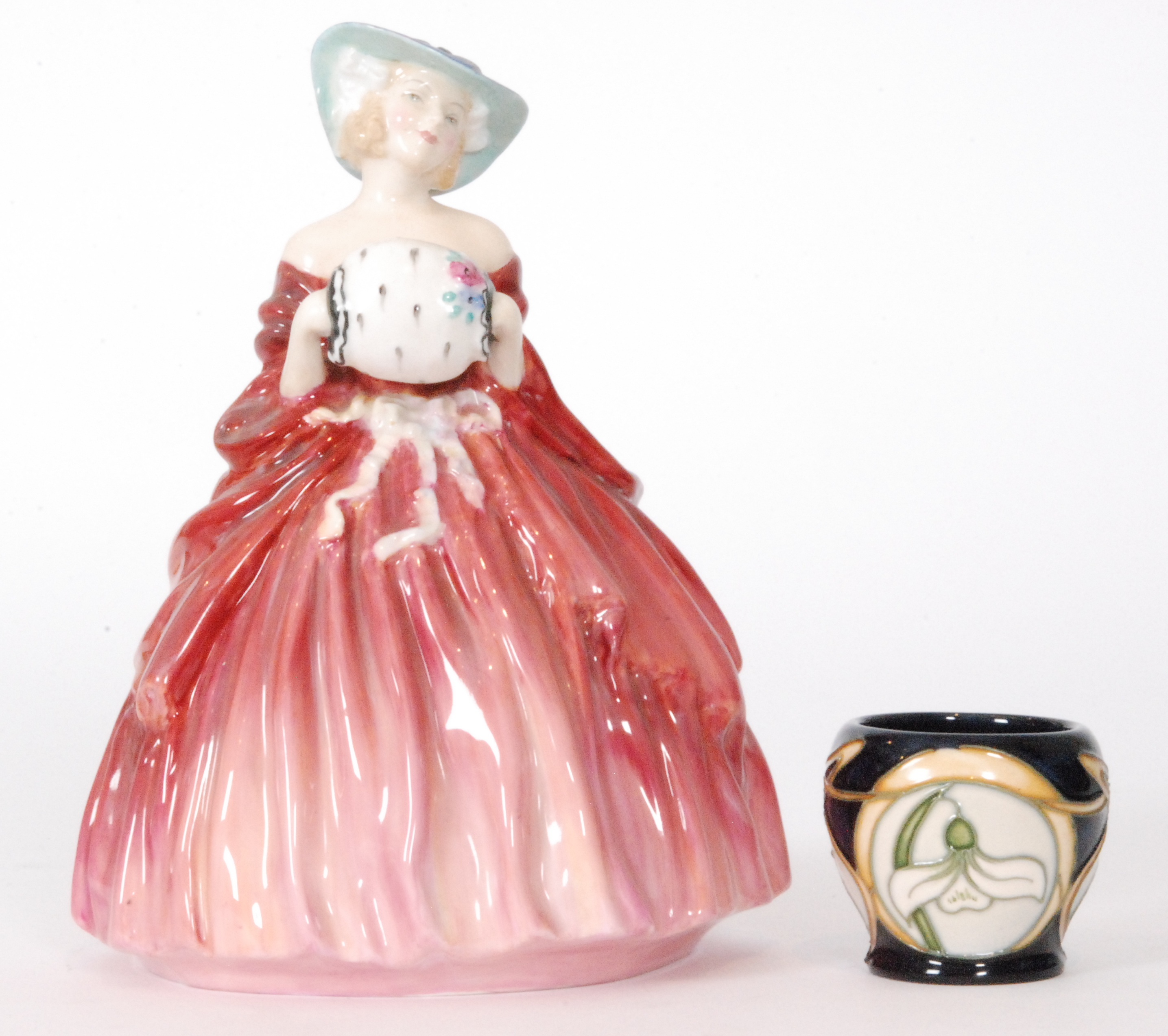 A Royal Doulton figurine Genevieve HN1962 and a Moorcroft Pottery eggcup decorated in the Parisian