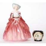 A Royal Doulton figurine Genevieve HN1962 and a Moorcroft Pottery eggcup decorated in the Parisian