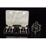 An Art Deco hallmarked silver four division toast rack,