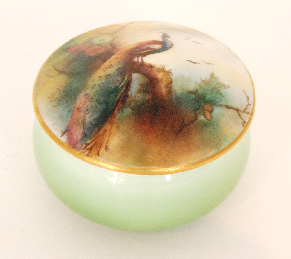 A Royal Worcester pill box and cover,