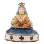 A Royal Doulton Lambeth trinket dish modelled as the Queen of Spades above a small blue glazed oval