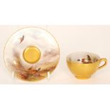 A Royal Worcester miniature cabinet cup and saucer decorated by James Stinton with hand painted