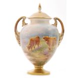 A later 20th Century Royal Worcester twin handled pedestal vase and cover panel decorated by