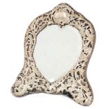 An Edwardian hallmarked silver easel back heart shaped mirror,