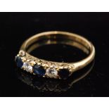 An early 20th Century 18ct sapphire and diamond five stone ring, three sapphires spaced by diamonds,