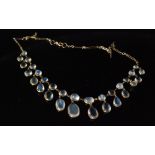 A moonstone fringe necklace designed as a series of graduated oval spectacle set stones with