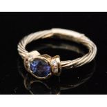 A contemporary 14ct tanzanite and diamond ring,