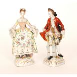 A pair of early 20th Century Naples porcelain figurines depicting a lady and gentleman in Regency