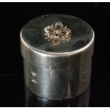 A modern hallmarked silver cylindrical ring box of plain form with a small bow to cover, height 3.