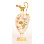 A late 19th Century Royal Worcester shape 1144 pedestal ewer decorated with a spray of gilt and