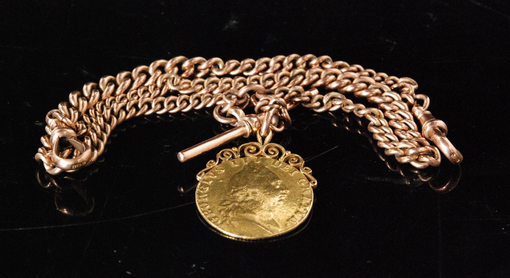 A 9ct rose gold graduated Albert chain with suspended George III 1789 guinea fob,