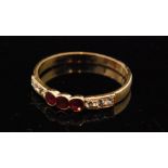 An 18ct ruby and diamond nine stone ring,