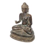 A Ming dynasty Thai bronze Buddha meditating in seated pose with right hand held in the Karana