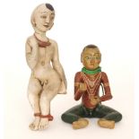 A Burmese carved wooden figure of a child with painted finish and another (2)
