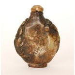 A Chinese carved moss agate scent bottle of flattened circular outline,
