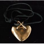 A hallmarked 9ct chubby heart shaped pendant,