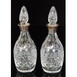 A pair of modern hallmarked silver and glass mallet decanters,