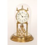 A 20th Century brass 365 day mantle clock in glass dome,