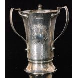 A hallmarked silver three handled cup, cylindrical form with and flared collet foot,