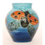 A Dennis China Works vase decorated to a design by Sally Tuffin with ladybirds against a blue wash