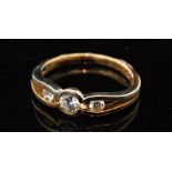 An 18ct hallmarked diamond three stone ring,