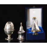 A modern cased hallmarked silver compendium of conical from opening to a gilt thimble,